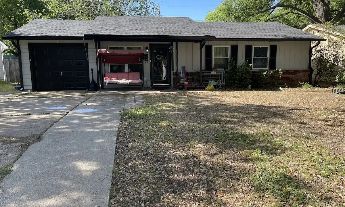 Wind Damage Roof Repair crew at work on a residential roof in Zebulon